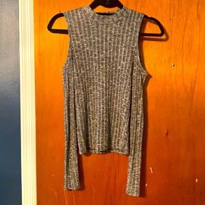 Open-shoulder long-sleeve ribbed top.